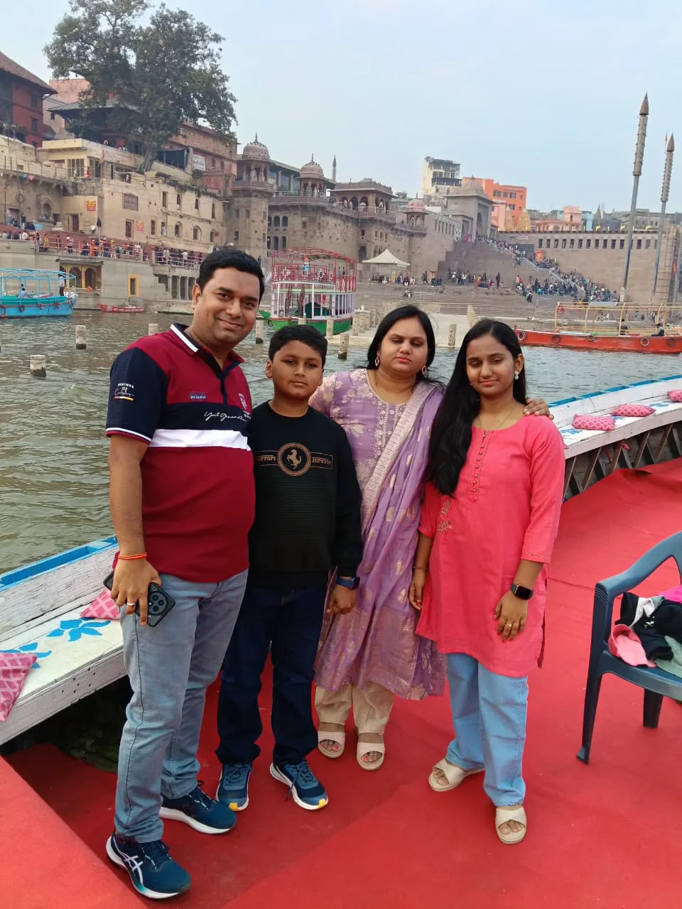 Family boat ride with the Varanasi ghats in the background